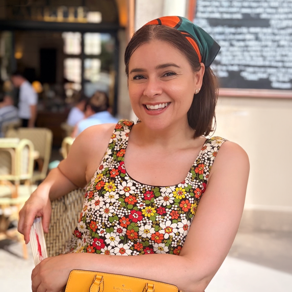 Evonnia Dominguez smiling at a Paris cafe